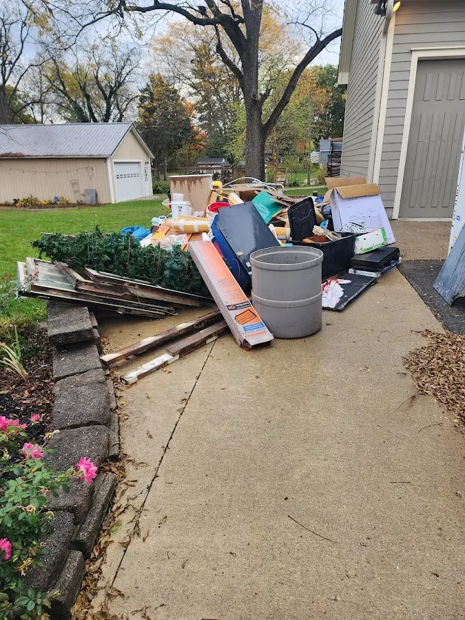 Dumpster being loaded with debris for 10 Yard Dumpster Rental in Acton